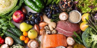 10 Essential Nutrients for Optimal Fitness and Health Assortment of healthy food ingredients for cooking, flat lay, view from above